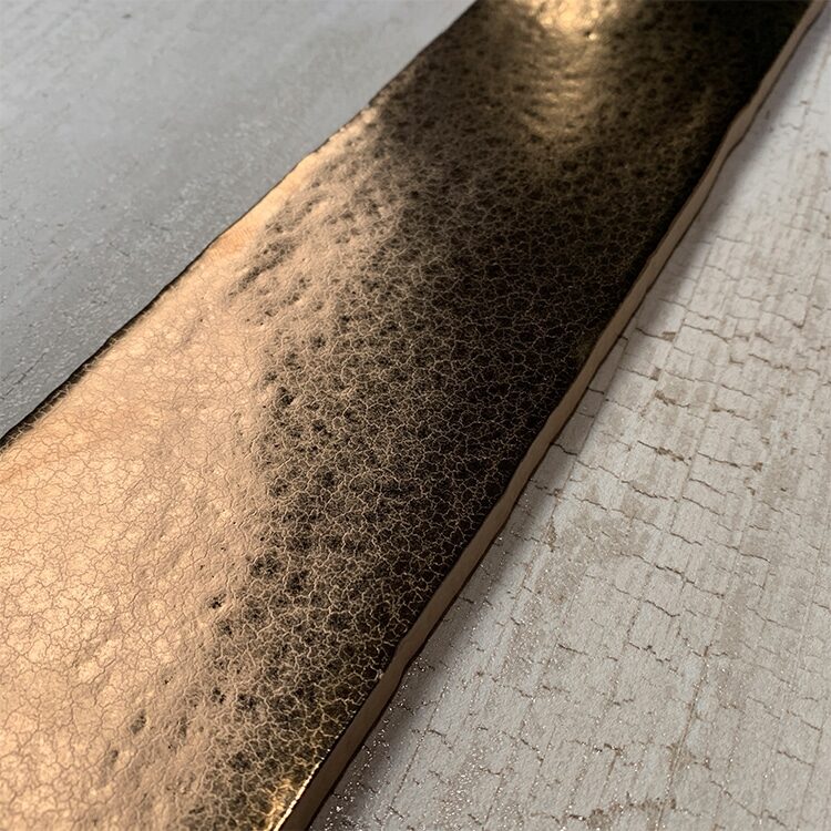 Close-up van gouden handvorm tegel